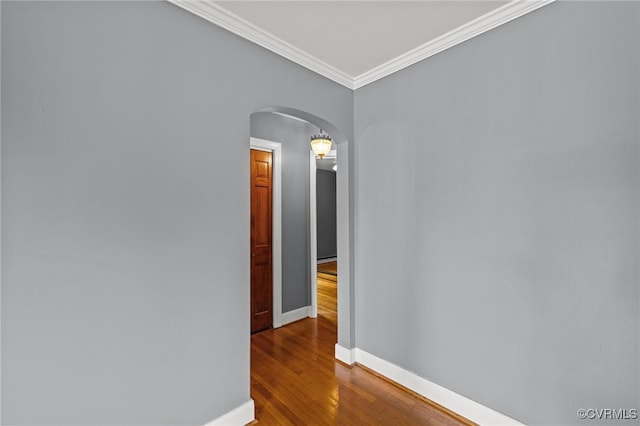 2405 Dumbarton Rd, Henrico, VA 23228 - hallway featuring arched walkways, baseboards, dark wood-style floors, and crown molding