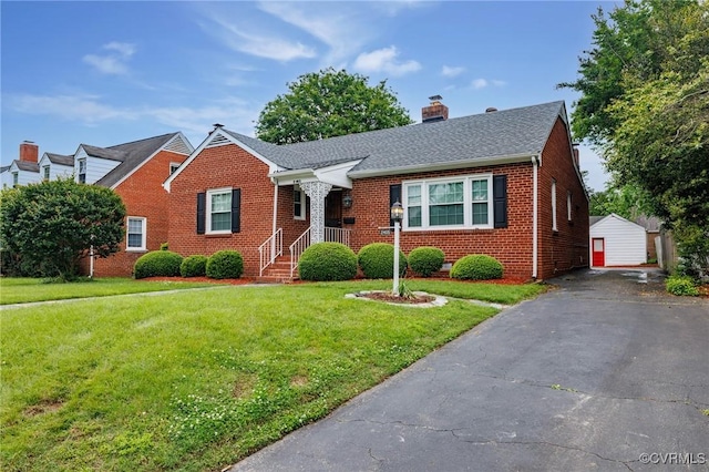 2405 Dumbarton Rd, Henrico, VA 23228 - bungalow with brick siding, a chimney, a front yard, and an outbuilding