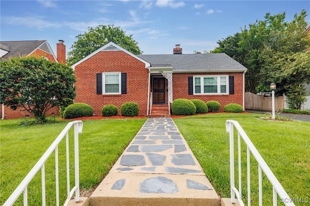 2405 Dumbarton Rd, Henrico, VA 23228 - bungalow-style home with brick siding and a chimney