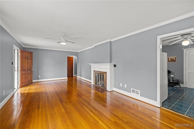 2405 Dumbarton Rd, Henrico, VA 23228 - unfurnished living room featuring a ceiling fan, arched walkways, wood finished floors, ornamental molding, and baseboards