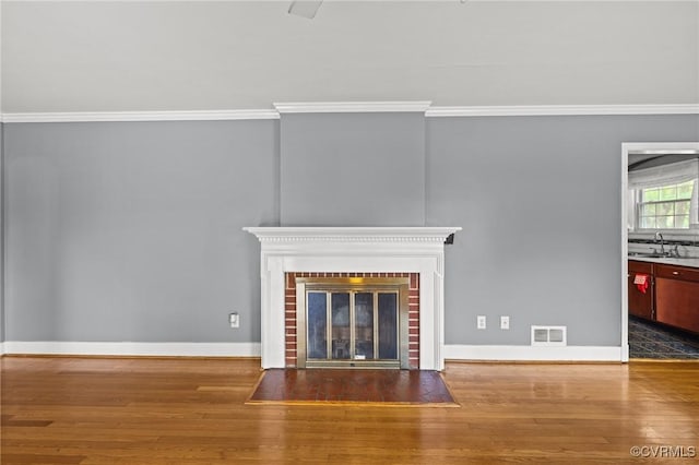 2405 Dumbarton Rd, Henrico, VA 23228 - detailed view of wood finished floors, crown molding, a fireplace, and baseboards