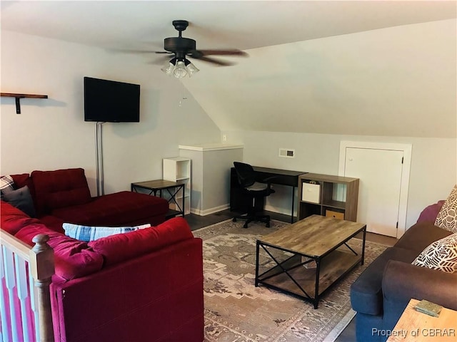 living room with ceiling fan and lofted ceiling