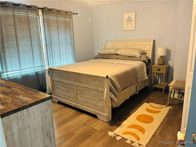 bedroom featuring wood finished floors