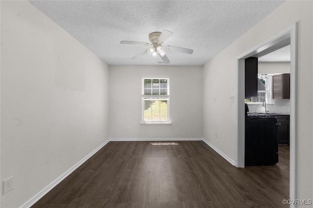 15119 Winding Ash Dr, Chesterfield, VA 23832 - unfurnished room featuring dark wood-type flooring, a ceiling fan, a textured ceiling, baseboards, and a sink