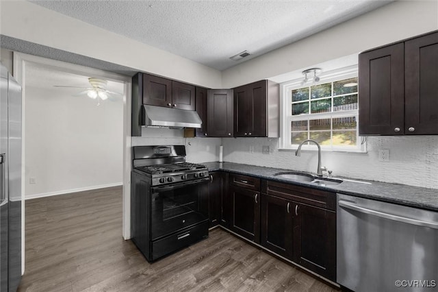 15119 Winding Ash Dr, Chesterfield, VA 23832 - kitchen featuring dishwasher, black gas range oven, under cabinet range hood, a sink, and a ceiling fan