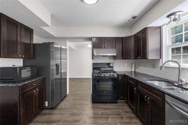 15119 Winding Ash Dr, Chesterfield, VA 23832 - kitchen with black appliances, a sink, under cabinet range hood, a textured ceiling, and dark brown cabinets