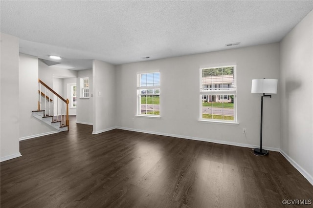 15119 Winding Ash Dr, Chesterfield, VA 23832 - unfurnished living room featuring dark wood-type flooring, a textured ceiling, stairs, and baseboards
