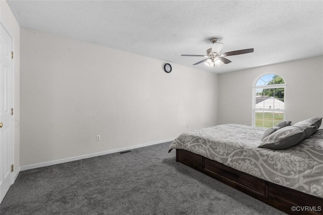 15119 Winding Ash Dr, Chesterfield, VA 23832 - carpeted bedroom featuring a textured ceiling, a ceiling fan, and baseboards