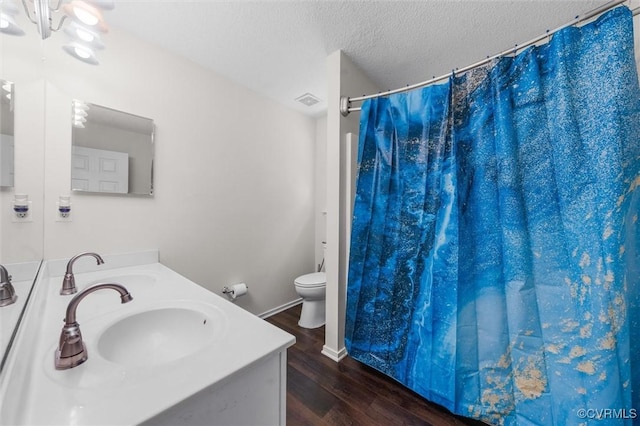 15119 Winding Ash Dr, Chesterfield, VA 23832 - bathroom featuring wood finished floors, toilet, a textured ceiling, vanity, and a shower with curtain