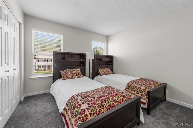 15119 Winding Ash Dr, Chesterfield, VA 23832 - carpeted bedroom with a closet, baseboards, and a textured ceiling