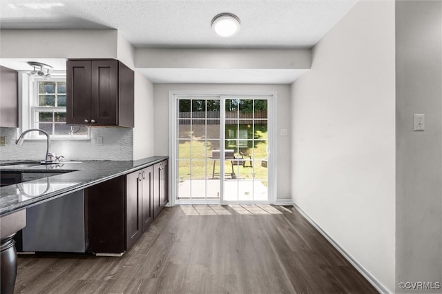 15119 Winding Ash Dr, Chesterfield, VA 23832 - kitchen with a sink, dark wood-style floors, dark brown cabinets, decorative backsplash, and dark countertops