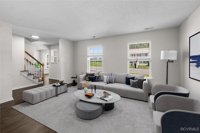 15119 Winding Ash Dr, Chesterfield, VA 23832 - living area with dark wood-type flooring, a textured ceiling, stairway, and baseboards