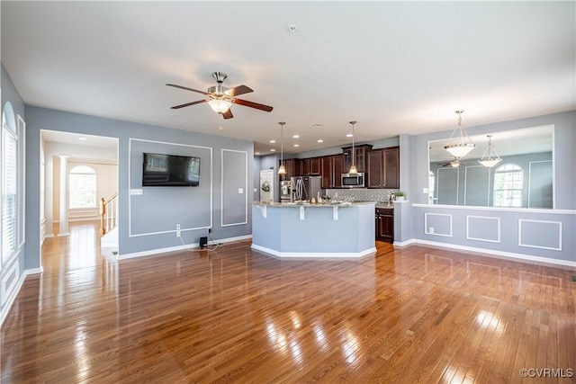 521 Siena Ln, Henrico, VA 23059 - unfurnished living room featuring a ceiling fan and wood finished floors
