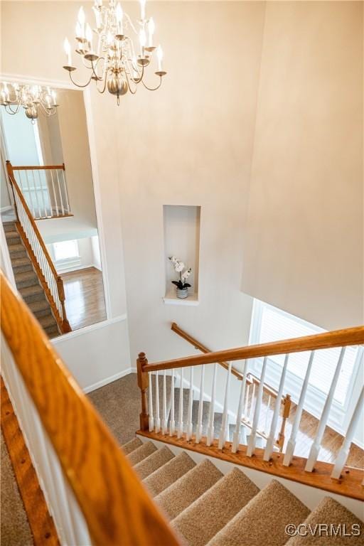 521 Siena Ln, Henrico, VA 23059 - stairs featuring a chandelier, healthy amount of natural light, and carpet flooring