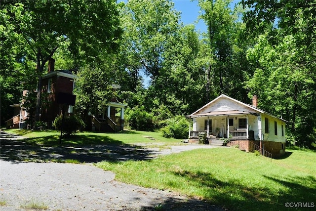 1006 N Main St, Farmville, VA 23901 - view of green lawn featuring covered porch and stairs