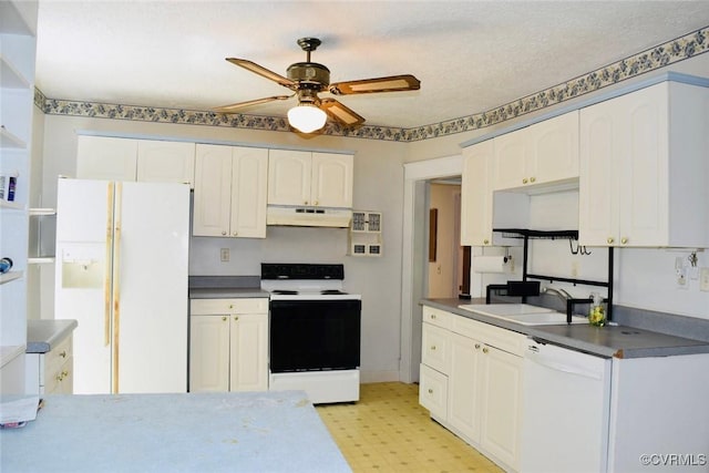 1006 N Main St, Farmville, VA 23901 - kitchen with white appliances, under cabinet range hood, a sink, a ceiling fan, and dark countertops