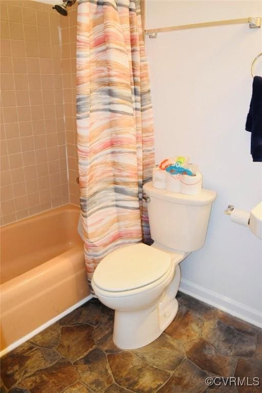 1006 N Main St, Farmville, VA 23901 - full bath with baseboards, shower / bath combination with curtain, toilet, and stone finish floors