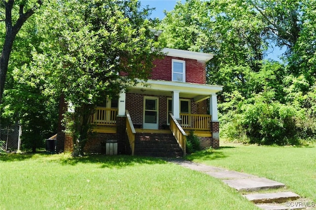 1006 N Main St, Farmville, VA 23901 - traditional style home with brick siding, covered porch, a front lawn, and stairway