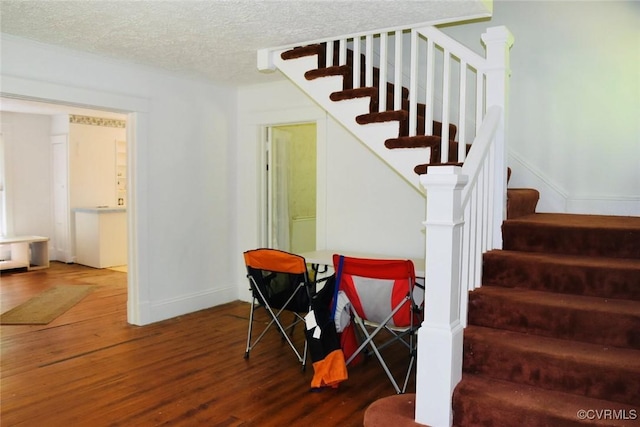 1006 N Main St, Farmville, VA 23901 - stairs featuring wood finished floors and a textured ceiling