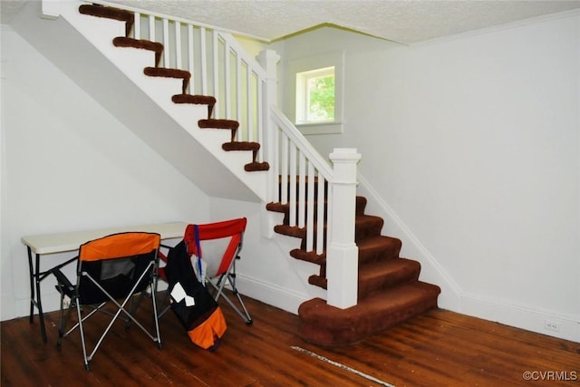 1006 N Main St, Farmville, VA 23901 - stairway with wood finished floors, a textured ceiling, and baseboards