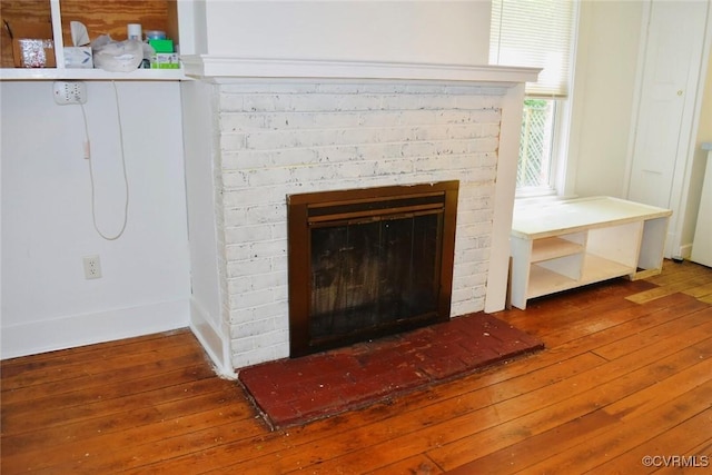 1006 N Main St, Farmville, VA 23901 - detailed view of wood finished floors and a brick fireplace