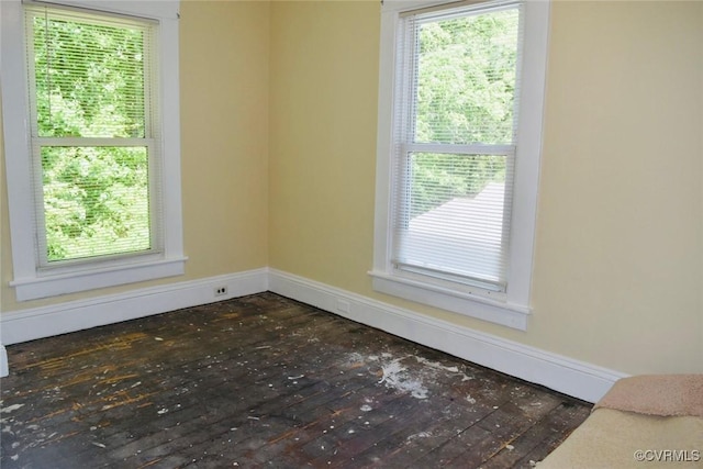1006 N Main St, Farmville, VA 23901 - spare room featuring baseboards, dark wood finished floors, and plenty of natural light