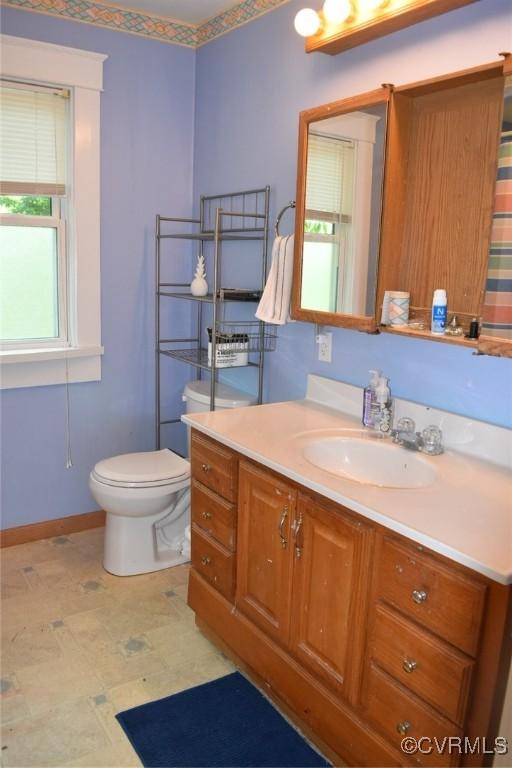 1006 N Main St, Farmville, VA 23901 - bathroom with toilet, vanity, baseboards, and tile patterned floors