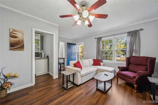 102 Market St, Onancock, VA 23417 - living room featuring crown molding, dark wood-style flooring, ceiling fan, and baseboards