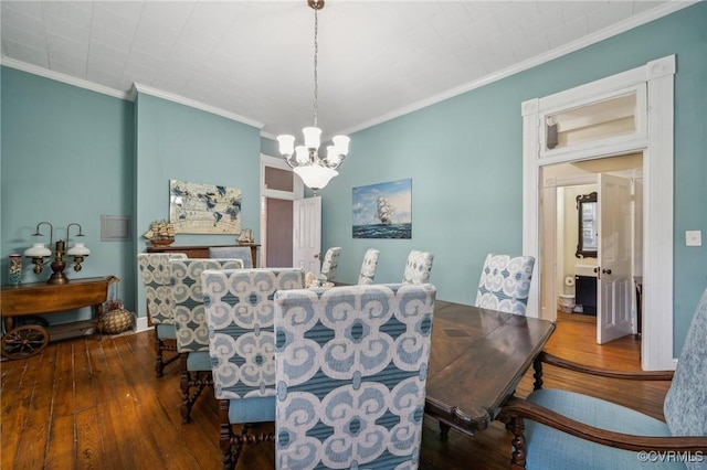 102 Market St, Onancock, VA 23417 - dining space featuring a chandelier, hardwood / wood-style floors, and ornamental molding