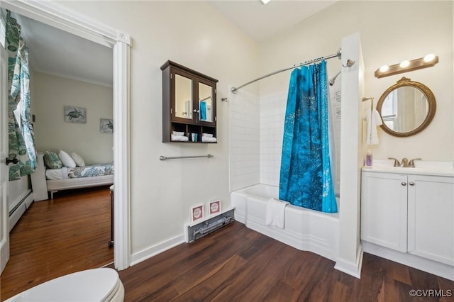 102 Market St, Onancock, VA 23417 - full bathroom featuring wood finished floors, shower / bath combo, toilet, a baseboard radiator, and vanity