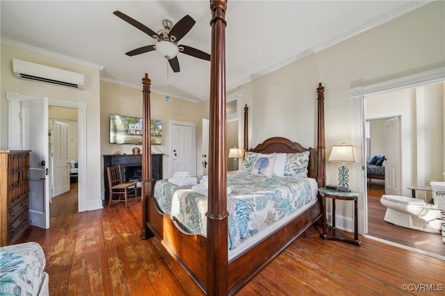 102 Market St, Onancock, VA 23417 - bedroom with a wall mounted air conditioner, crown molding, hardwood / wood-style flooring, a fireplace, and a ceiling fan