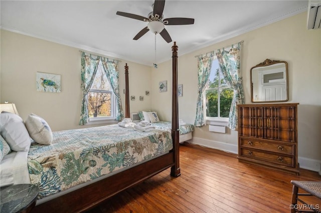 102 Market St, Onancock, VA 23417 - bedroom featuring hardwood / wood-style floors, baseboards, crown molding, and ceiling fan