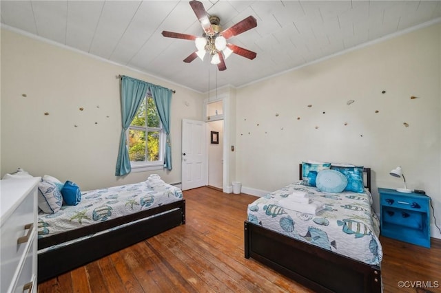 102 Market St, Onancock, VA 23417 - bedroom with hardwood / wood-style floors, ornamental molding, baseboards, and a ceiling fan