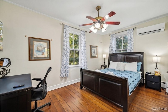 102 Market St, Onancock, VA 23417 - bedroom with an AC wall unit, a desk, wood-type flooring, baseboards, and crown molding