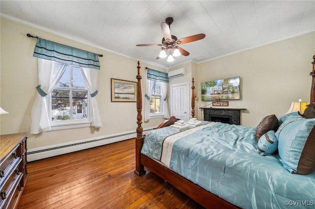 102 Market St, Onancock, VA 23417 - bedroom with a wall mounted air conditioner, baseboard heating, wood-type flooring, multiple windows, and crown molding