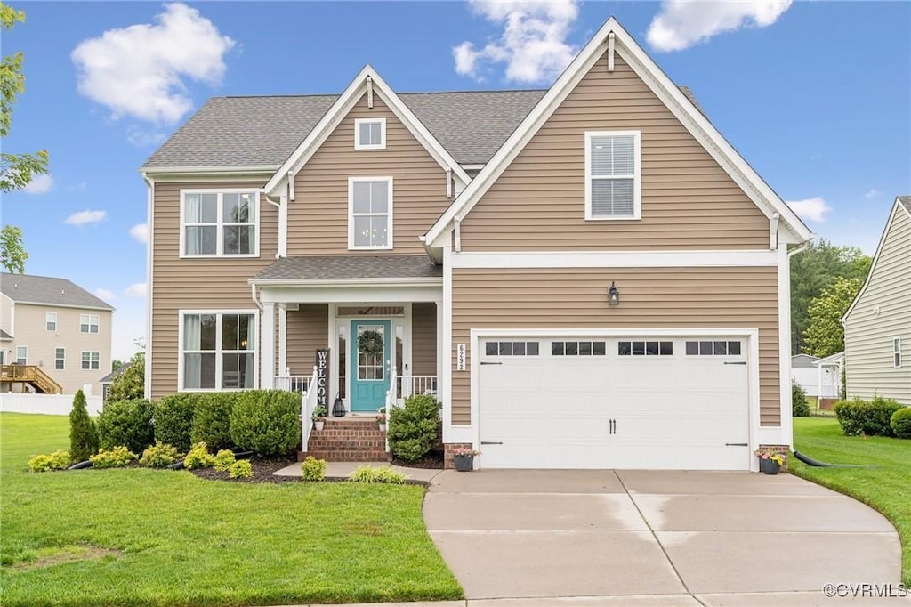 6292 Bunker Hill Dr, Mechanicsville, VA 23111 - traditional home with driveway, a front yard, and a garage
