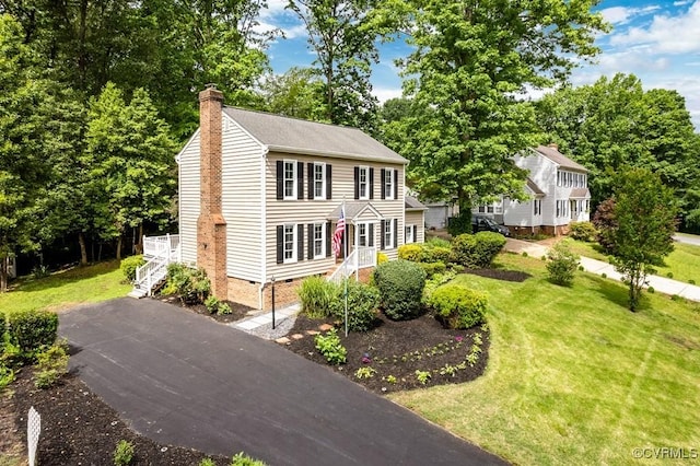 4800 Ball Cypress Rd, Chesterfield, VA 23832 - colonial-style house featuring a chimney, a front lawn, crawl space, and view of scattered trees