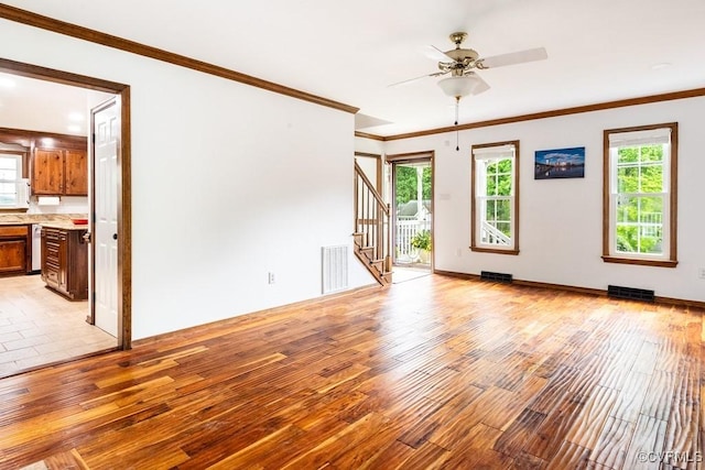 4800 Ball Cypress Rd, Chesterfield, VA 23832 - unfurnished living room featuring light wood-type flooring, stairway, ceiling fan, crown molding, and baseboards