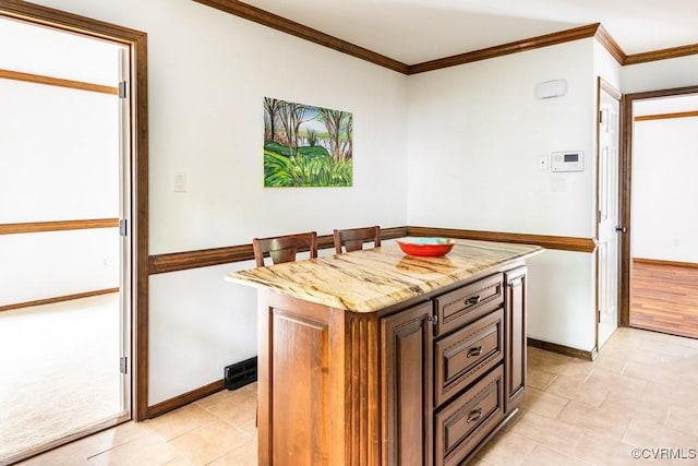 4800 Ball Cypress Rd, Chesterfield, VA 23832 - kitchen with crown molding, baseboards, light stone counters, a center island, and light tile patterned floors