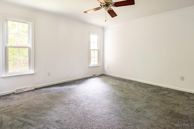 4800 Ball Cypress Rd, Chesterfield, VA 23832 - unfurnished room featuring plenty of natural light, dark carpet, a ceiling fan, baseboards, and crown molding