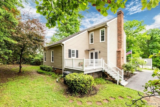 4800 Ball Cypress Rd, Chesterfield, VA 23832 - back of house with a chimney and a wooden deck