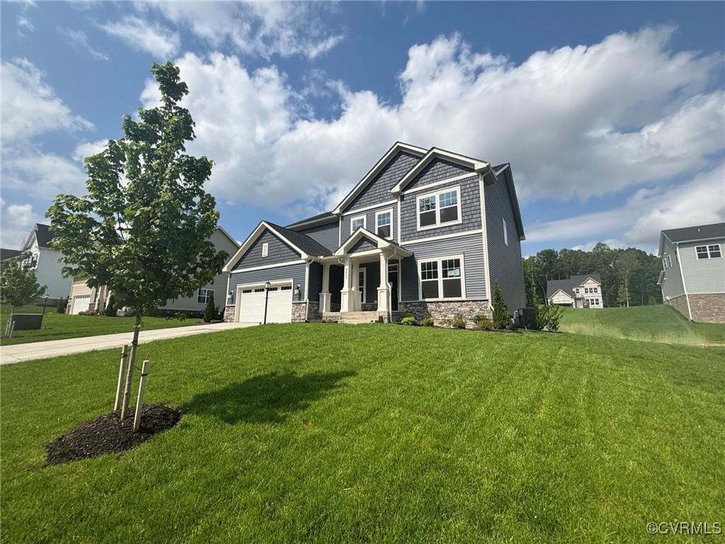 8625 Centerline Dr, Chesterfield, VA 23832 - craftsman house with stone siding, driveway, a front yard, and a garage