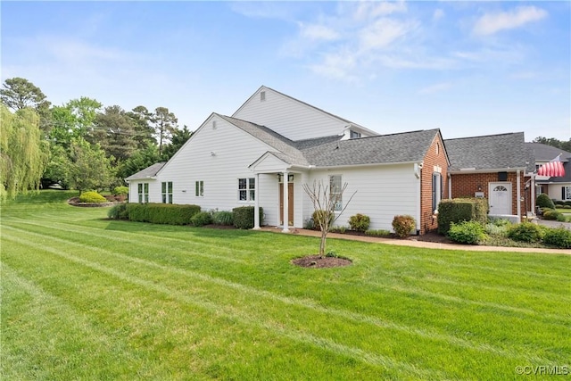 9428 Berry Patch Ln, Mechanicsville, VA 23116 - view of front of house featuring a front lawn and a shingled roof