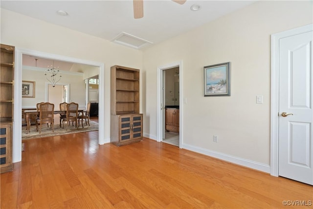 9428 Berry Patch Ln, Mechanicsville, VA 23116 - empty room with light wood-style flooring, baseboards, a ceiling fan, and attic access