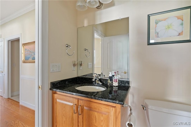 9428 Berry Patch Ln, Mechanicsville, VA 23116 - half bath featuring ornamental molding, toilet, vanity, and wood finished floors