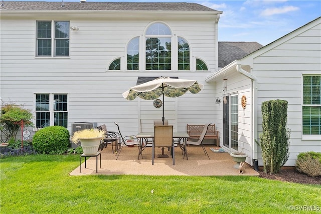 9428 Berry Patch Ln, Mechanicsville, VA 23116 - rear view of property with a patio, a yard, roof with shingles, and central AC unit