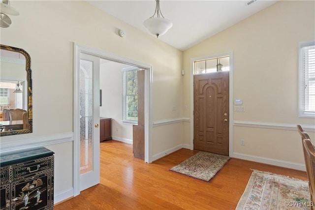 9428 Berry Patch Ln, Mechanicsville, VA 23116 - foyer entrance featuring light wood finished floors, lofted ceiling, and baseboards