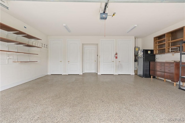 9428 Berry Patch Ln, Mechanicsville, VA 23116 - garage with freestanding refrigerator and a garage door opener