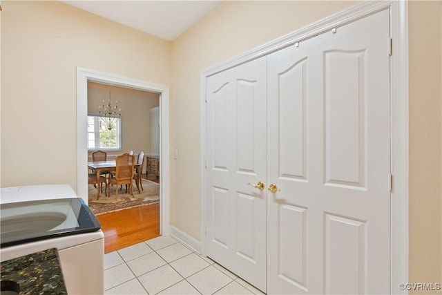 9428 Berry Patch Ln, Mechanicsville, VA 23116 - interior space featuring light tile patterned floors, a chandelier, and baseboards