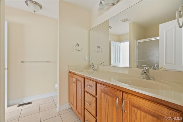 9428 Berry Patch Ln, Mechanicsville, VA 23116 - full bathroom featuring tile patterned flooring, a stall shower, double vanity, toilet, and baseboards